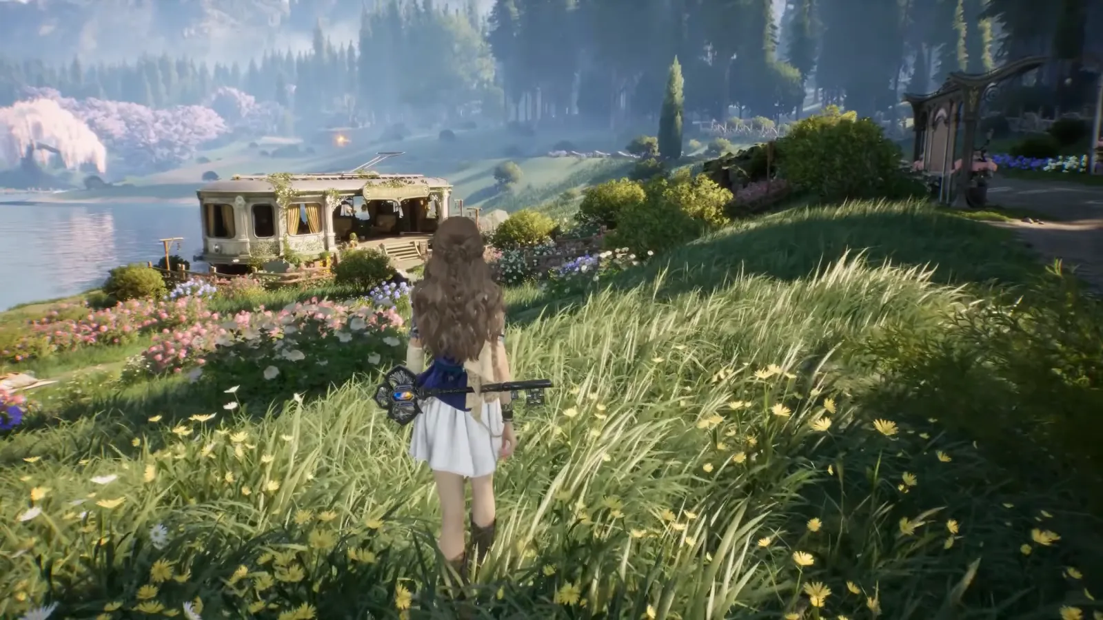 Girl standing in a lakeside flower meadow near a train